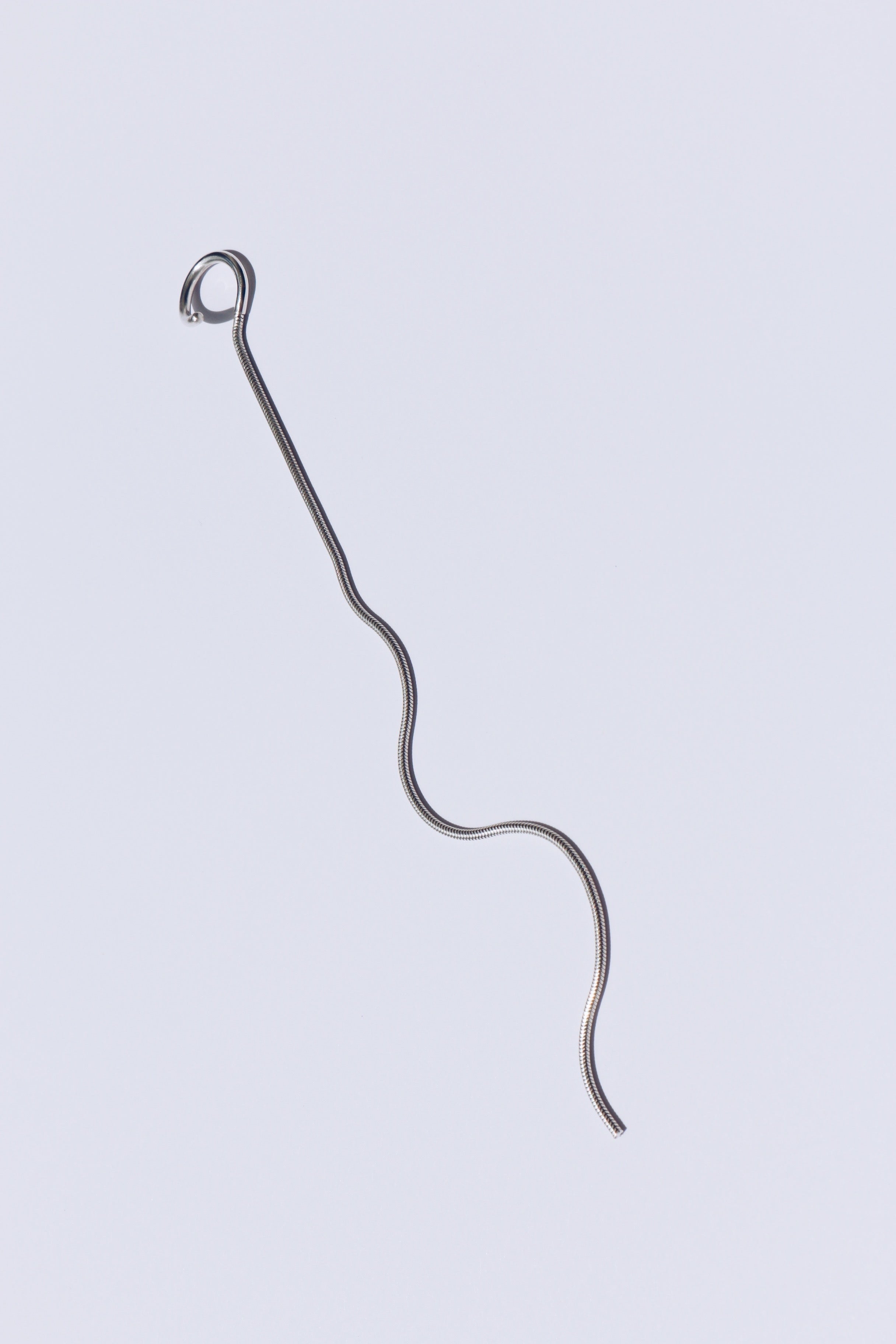 Minimalist ear cuff with a long snake chain